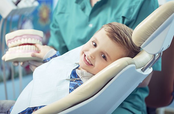 Boy smiling during dental visit - Harrison Pediatric Dentistry