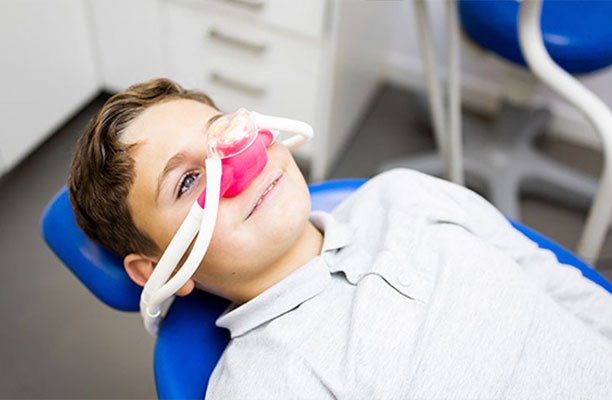Boy undergoing sedation dentistry treatment - Harrison Pediatric Dentistry